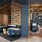 Resident lounge at our apartments for rent in Nashville, featuring a fireplace and leather couch seating.
