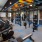 fitness center showing plenty of equipment and modern decor in a large, spacious room