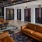 Resident lounge at our apartments for rent in Nashville, featuring wood grain floor paneling and leather couches.