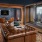 Resident lounge at our apartments for rent in Nashville, featuring a fireplace and leather couch seating.