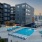 Pool lounge at our apartments for rent in Nashville, TN, featuring beach chairs and a view of the apartments.