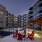 Pool lounge at our apartments for rent in Nashville, TN, featuring beach chairs and a shade structure.