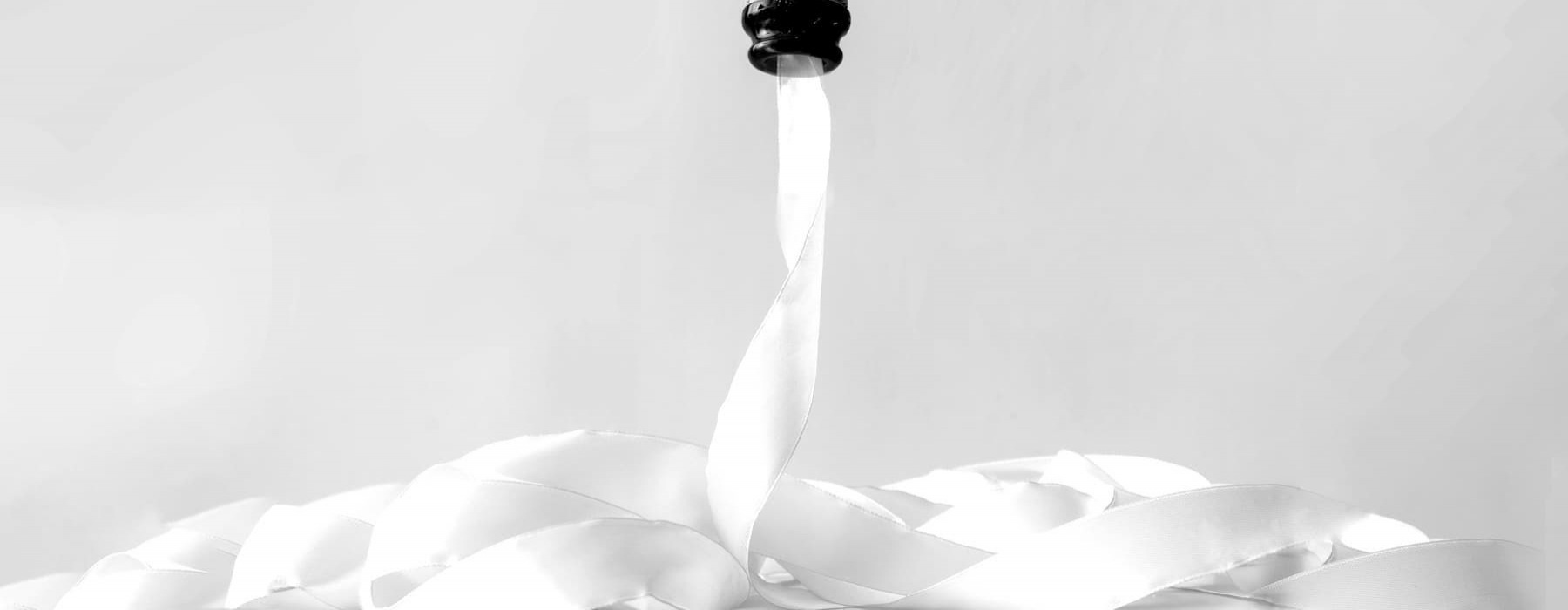 lifestyle image of a champagne bottle pouring something out